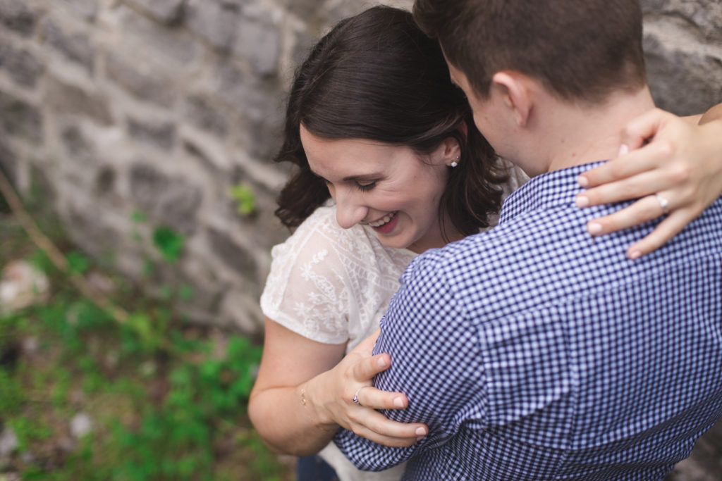 Couple cuddling in the Lime Kiln Ruins trail - Lime Kiln Ruins Trail Engagement Session - Ashley Notley Photography