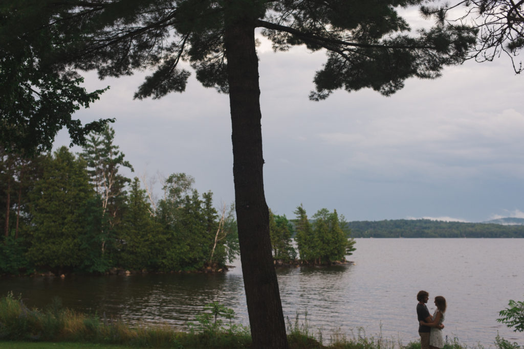 silhouette of couple standing by Calabogie lake together