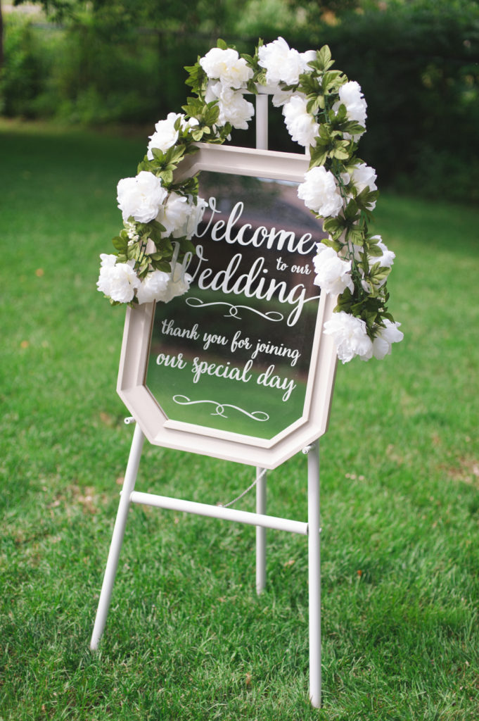 welcome to our wedding sign on a mirror