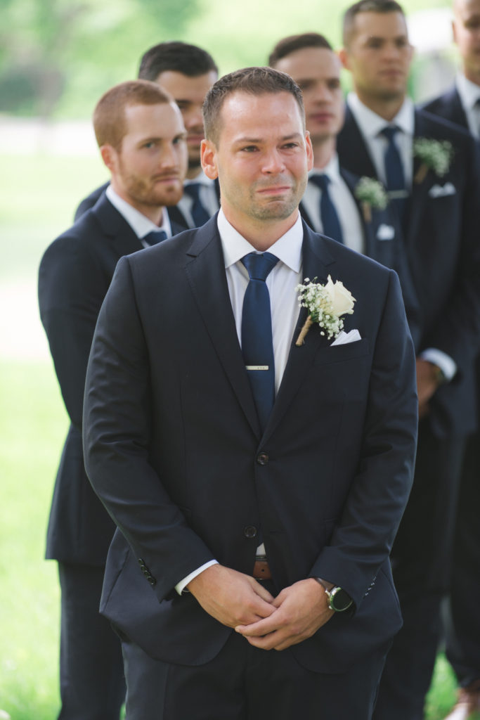 groom crying seeing his bride for the first time