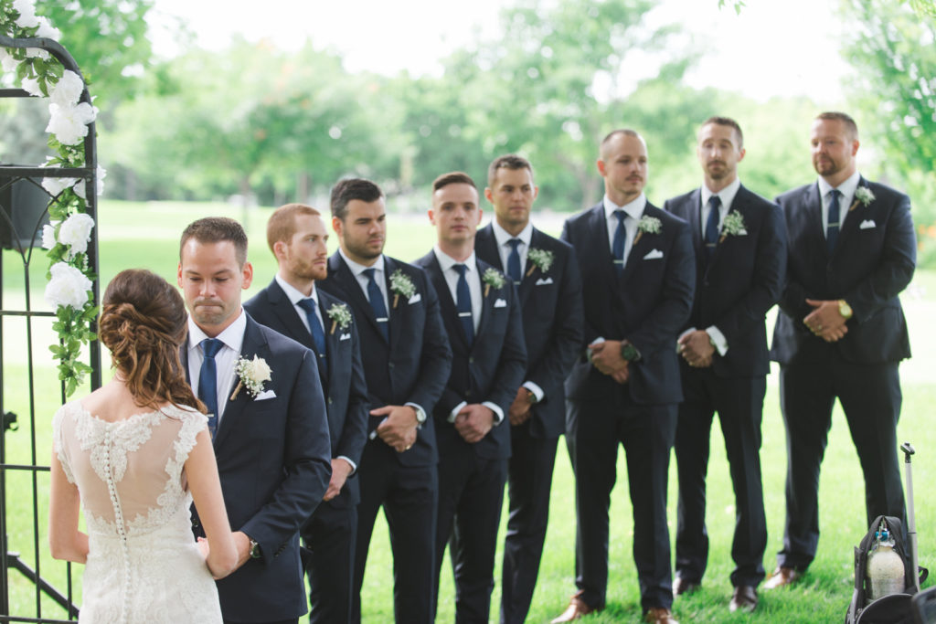 groomsmen lined up at the ceremony