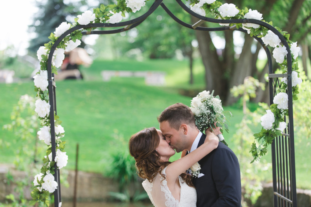 first kiss under the floral alter