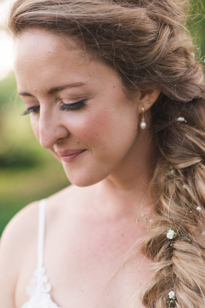 Bride with fishtail braid and baby's breath
