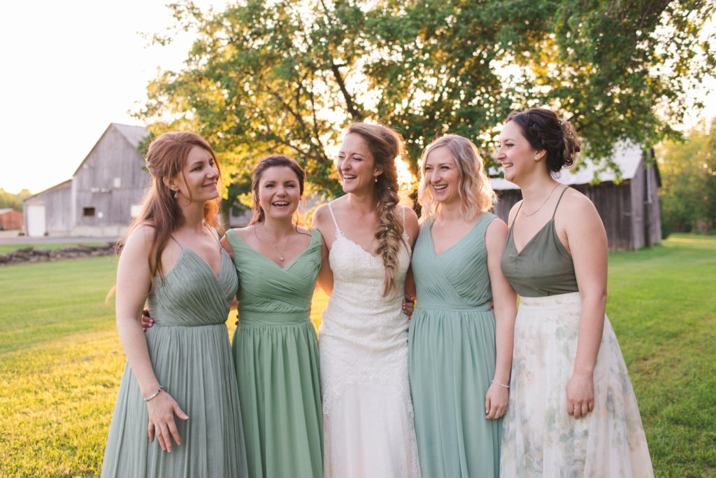 bridal party in sage green at sunset