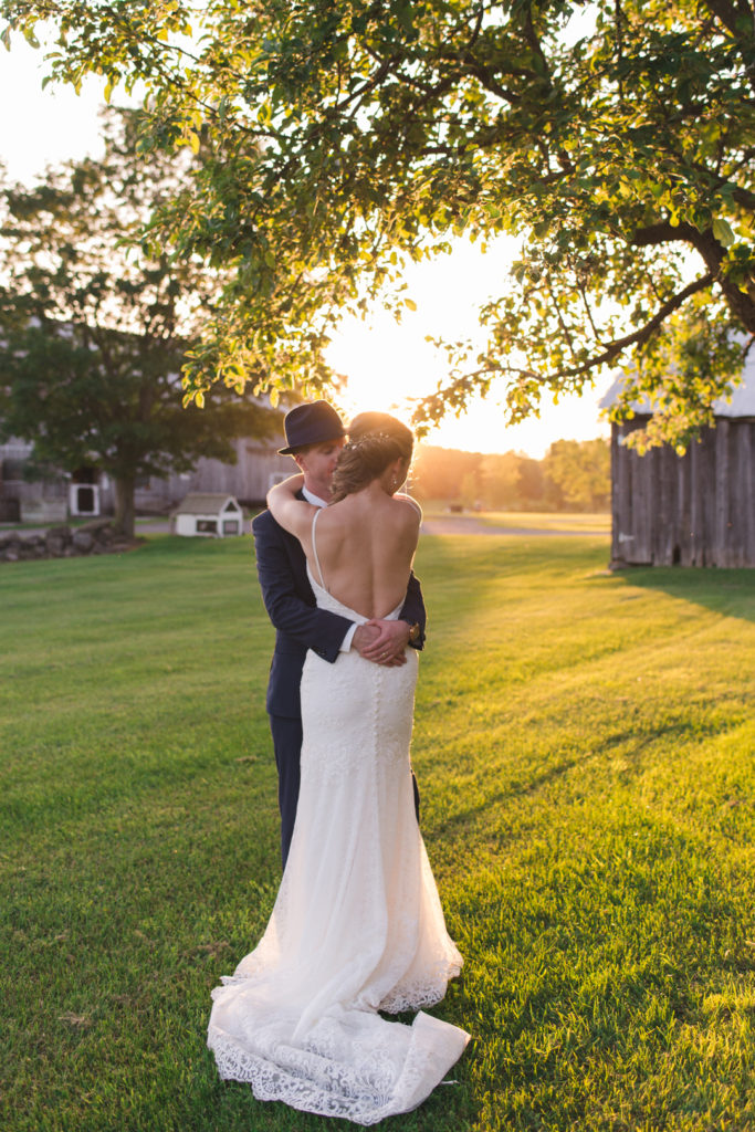 back of wedding dress at sunset at the farm