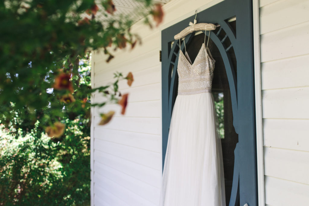 dress hanging on a blue cottage door