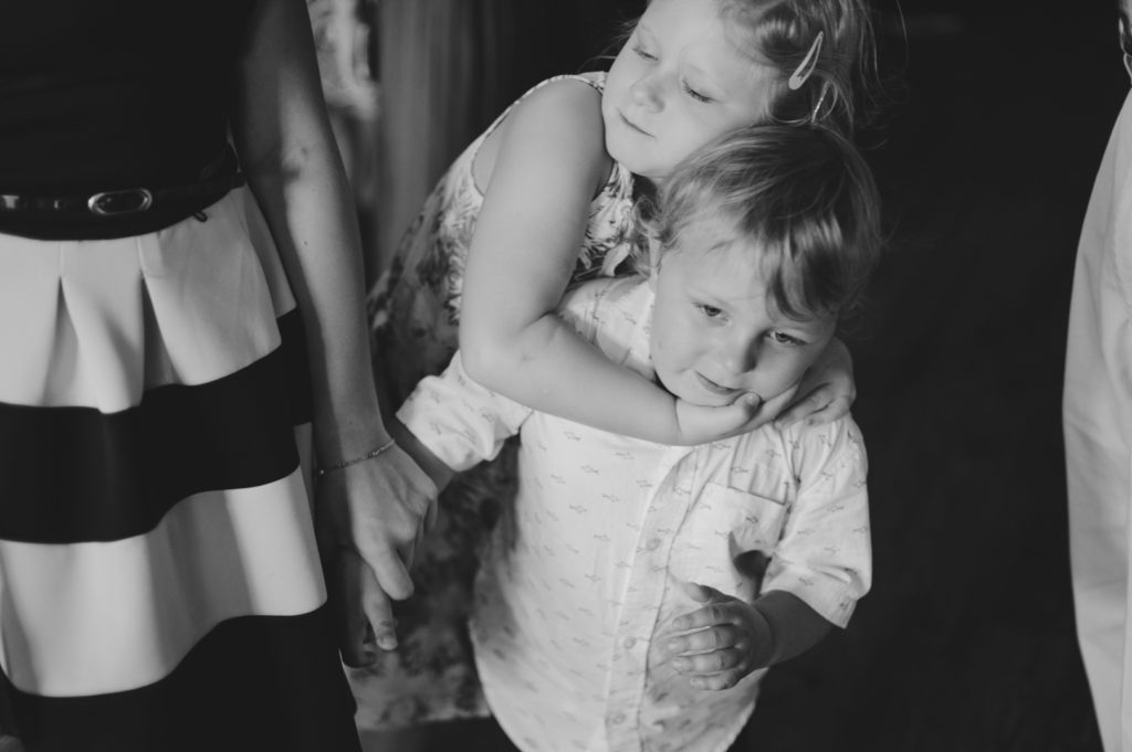 brother and sister hugging each other