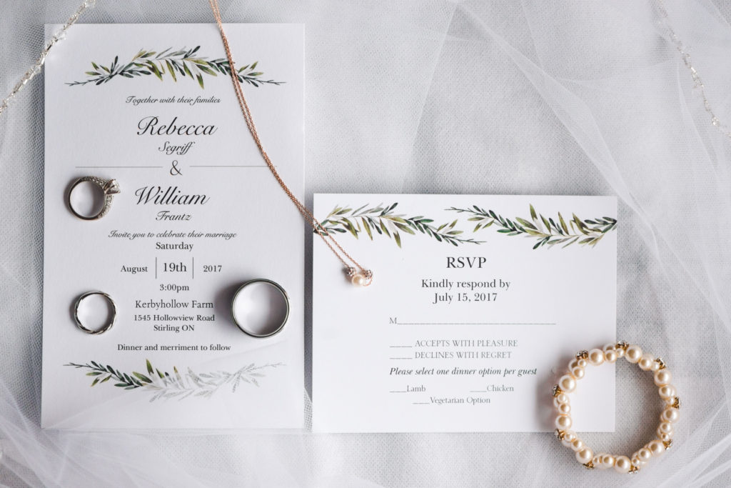 invitation suite with tree branches and gold jewellery