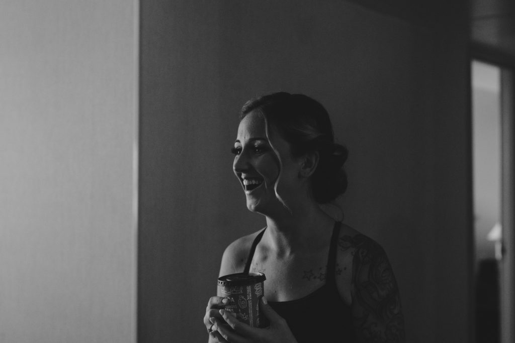 bride to be laughing holding her tim horton's coffee cup