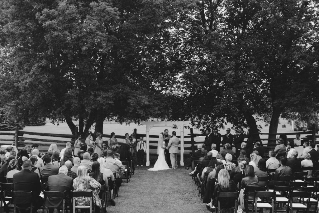 black and white photo of outdoor wedding ceremony