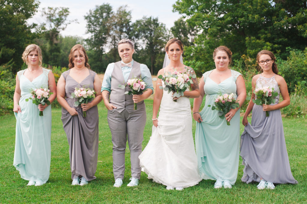 bride and bridesmaids wearing converses