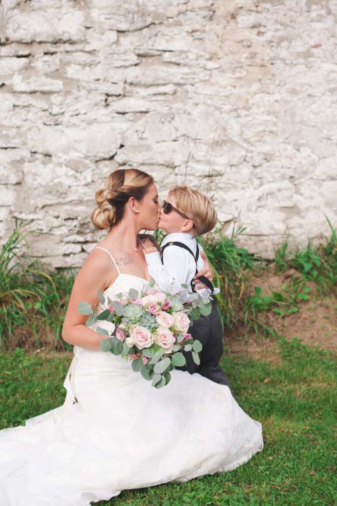 bride kissing her son