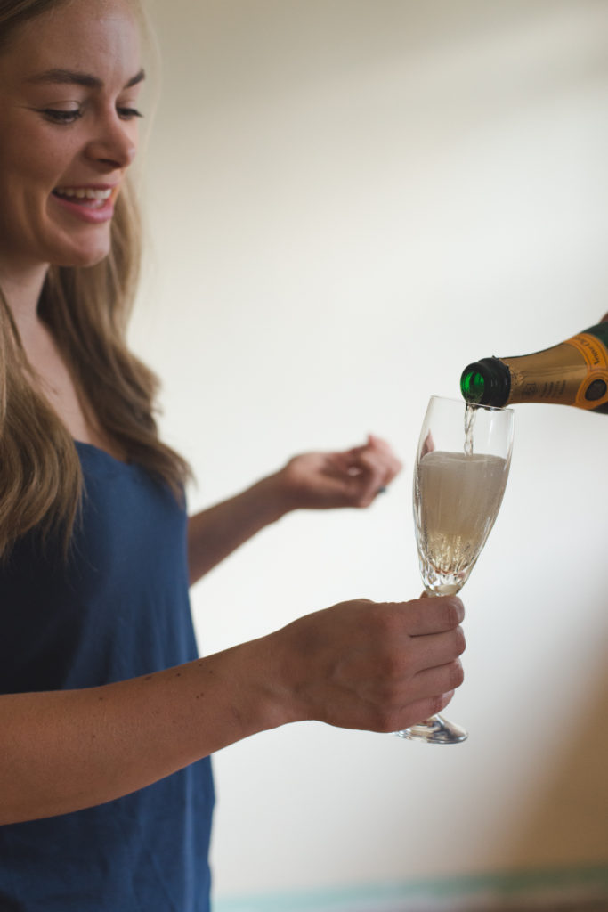 champagne toast in bride and groom's first home