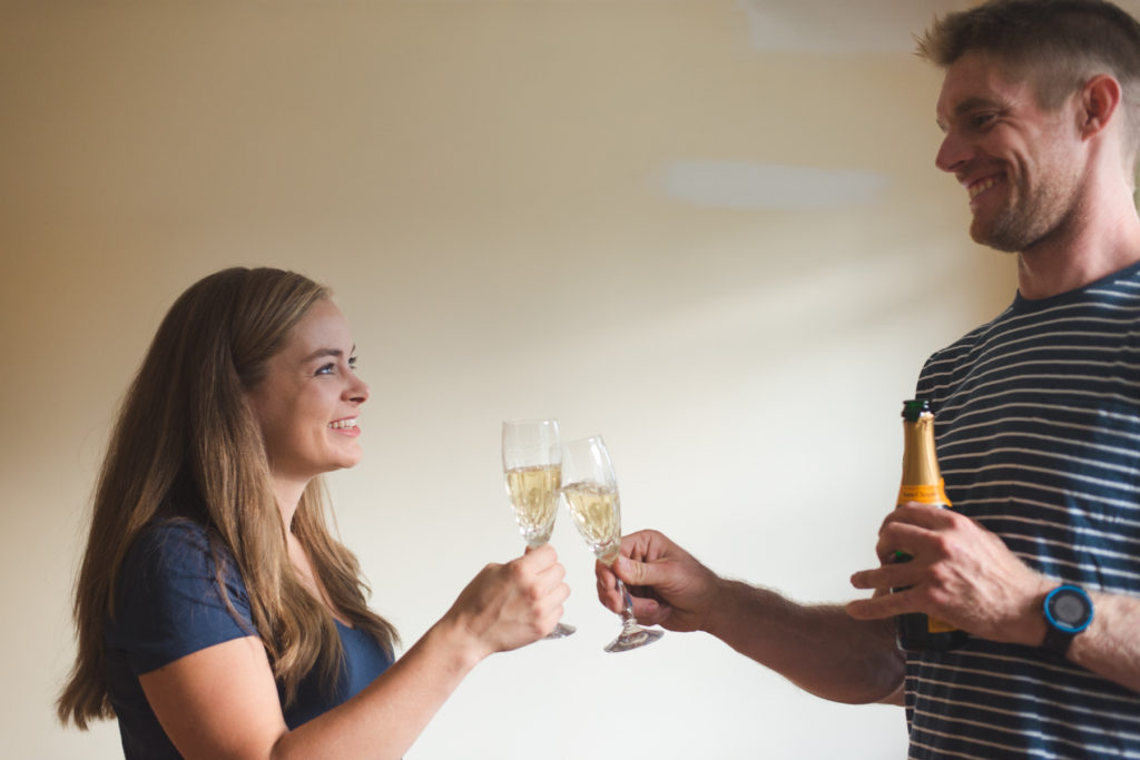 champagne toast in bride and groom's first home