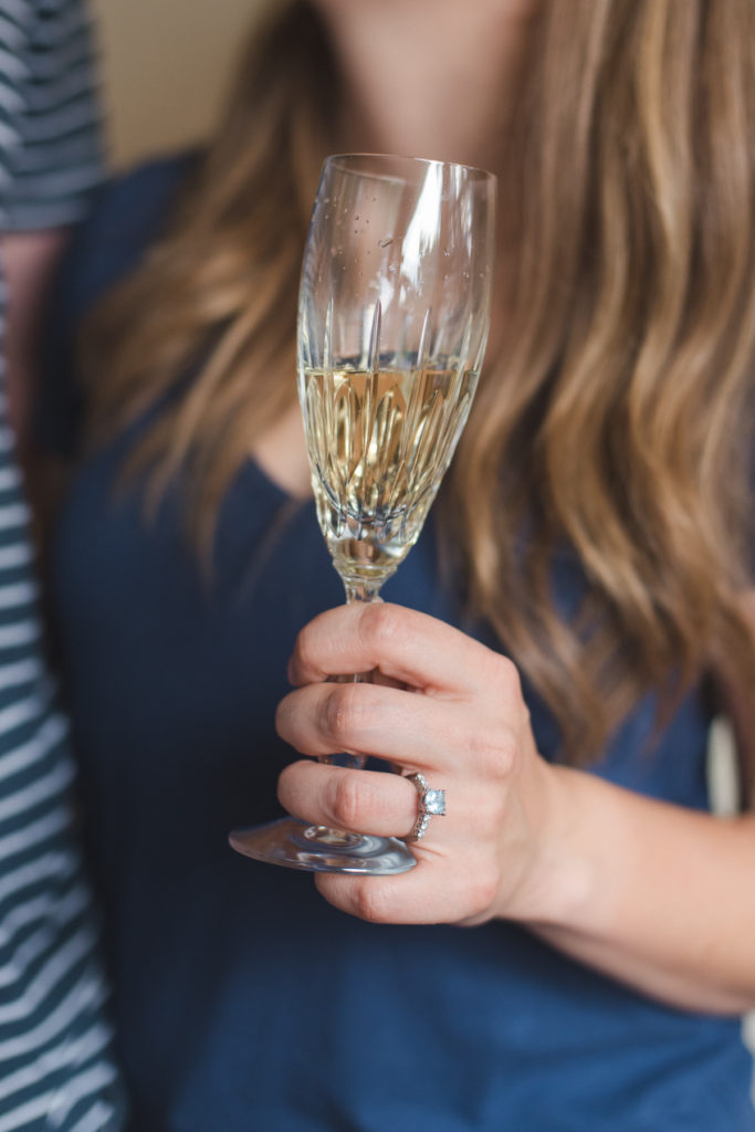 bride to be holding vintage glass of champagne