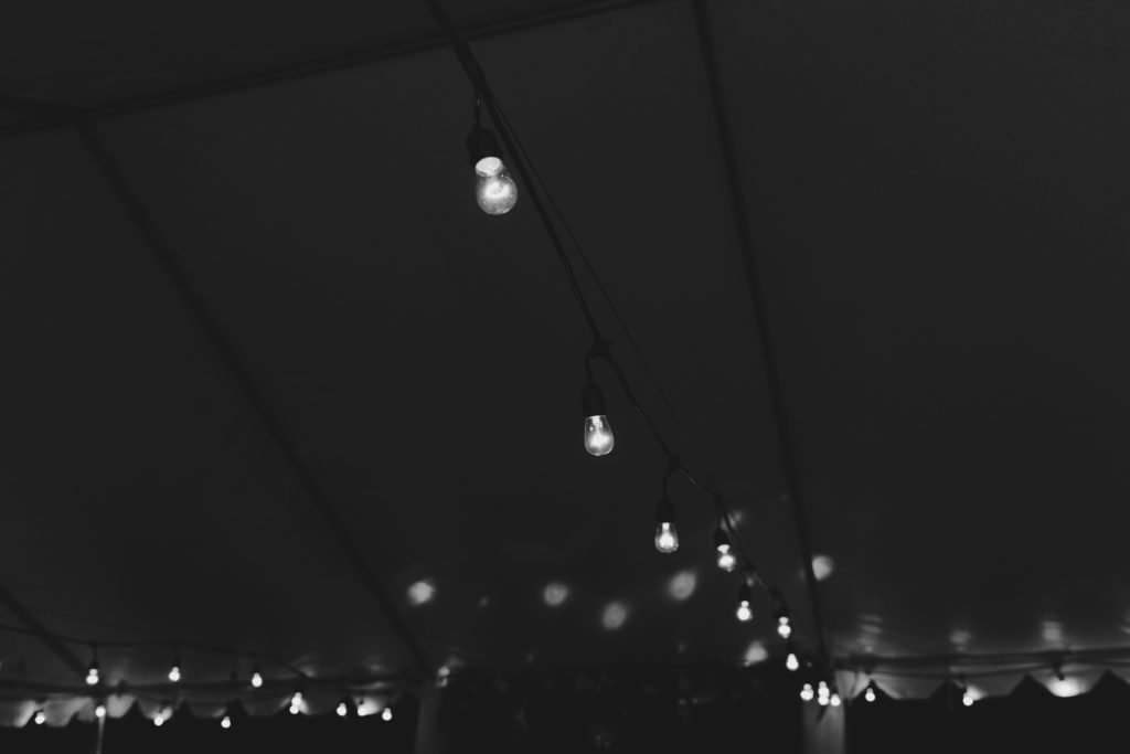 twinkly string lights in wedding tent