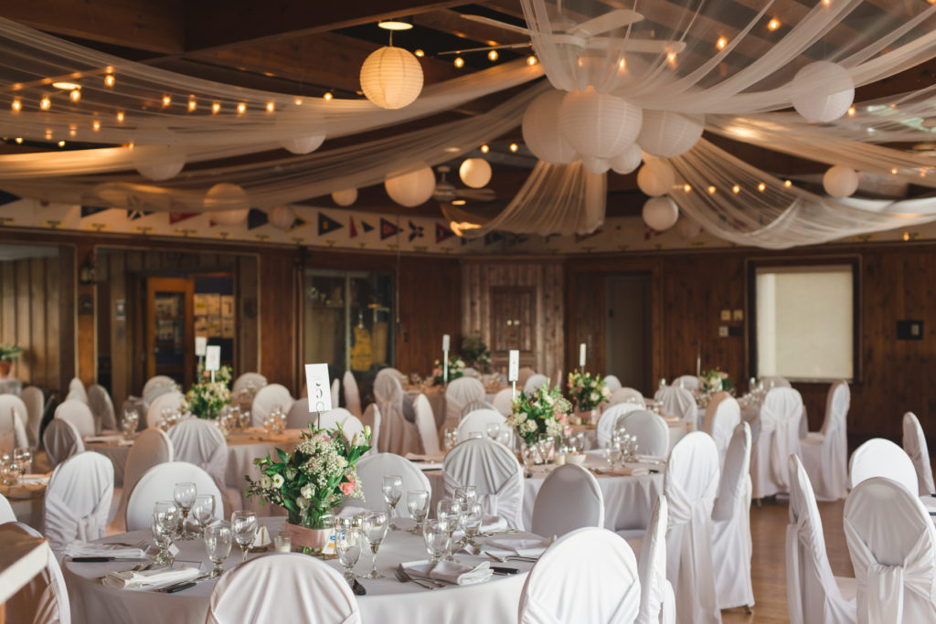 britannia yacht club wedding with green floral arrangements