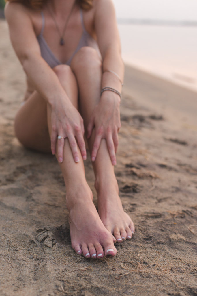 photo of legs in the sand
