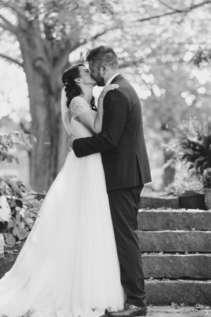 first kiss on stone steps at stanley's maple lane farm