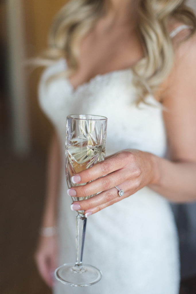 bride holding vintage champagne glass