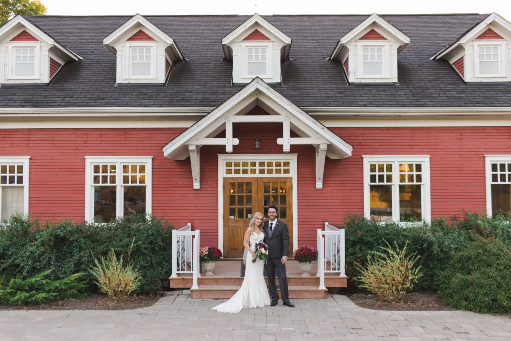 bride and groom in front of temples sugar bush