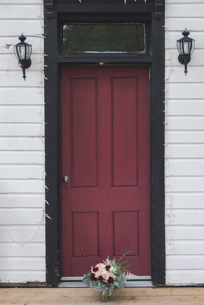 wedding flowers outside of school house door