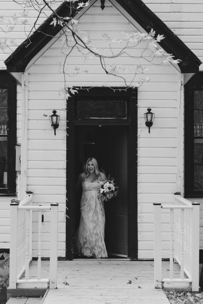 bride walking out of schoolhouse at Strathmere before first look