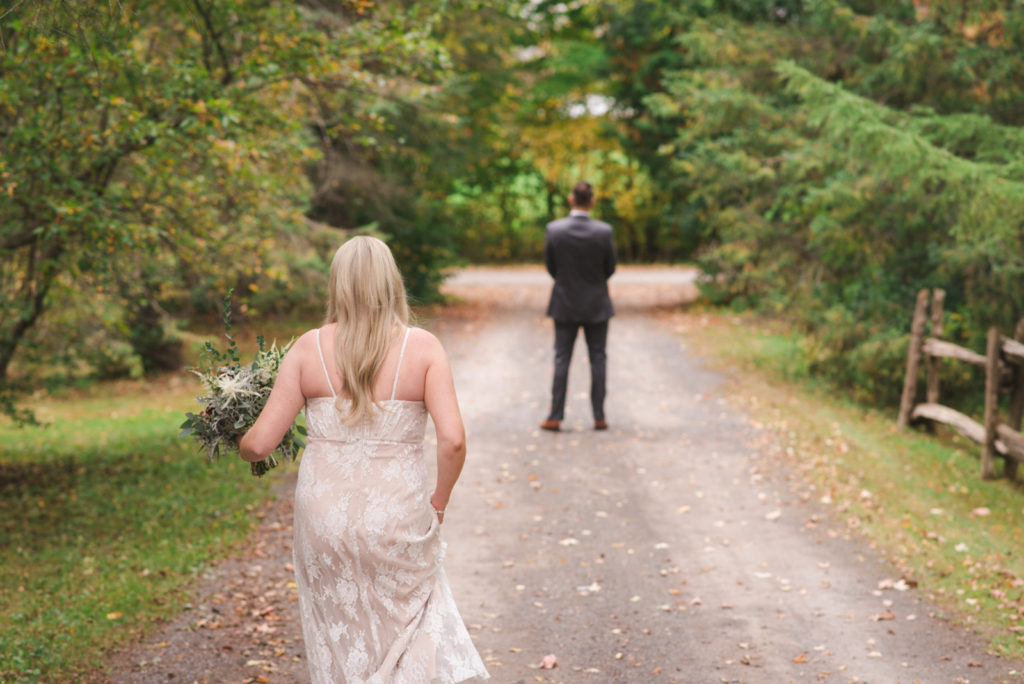 Bride walking towards her groom for first look