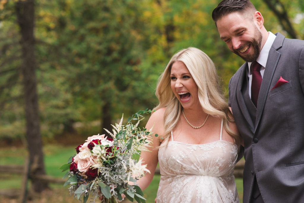 bride and groom laughing