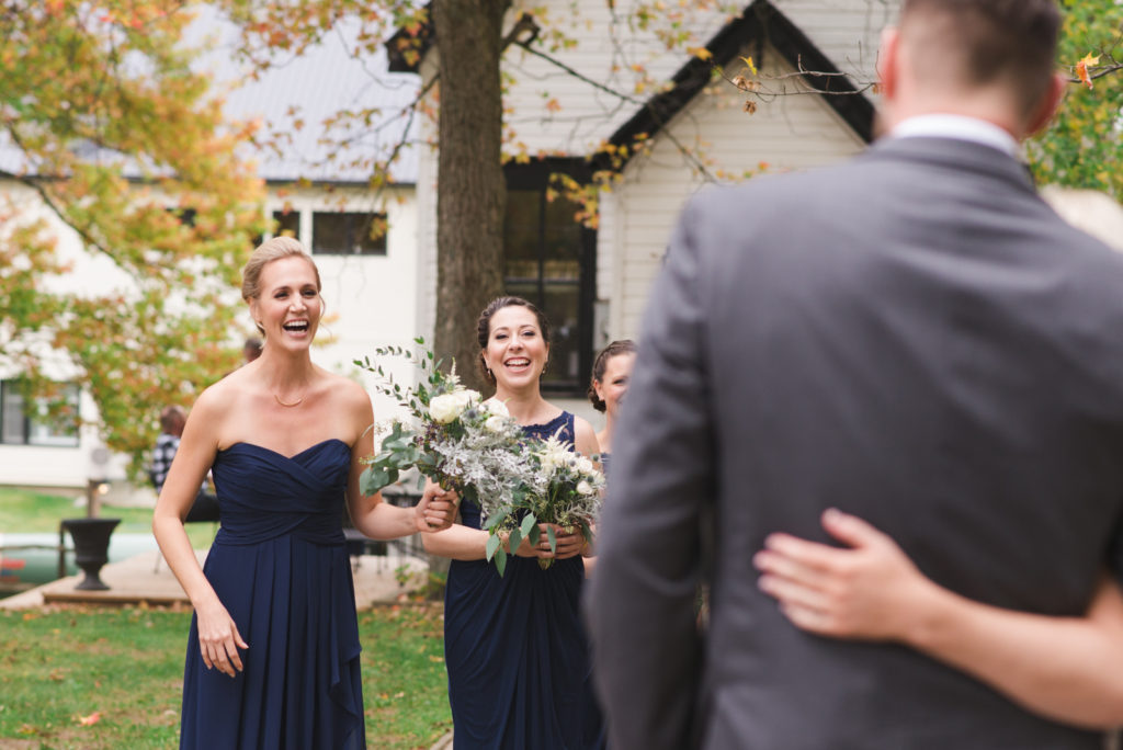 bridesmaids seeing bride and groom for the first time