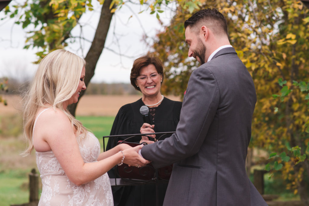 bride and groom exchanging rings