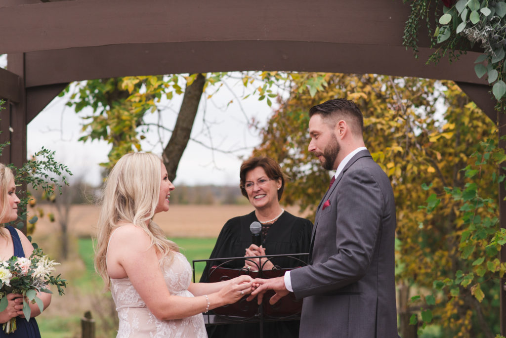 bride and groom exchanging rings