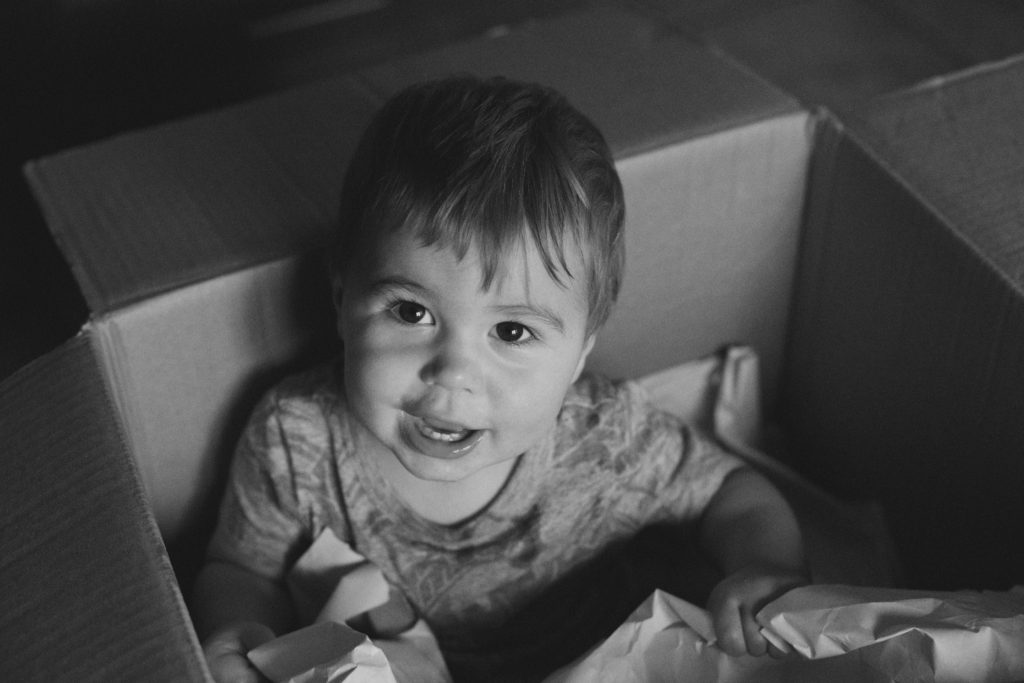 little boy in a moving box
