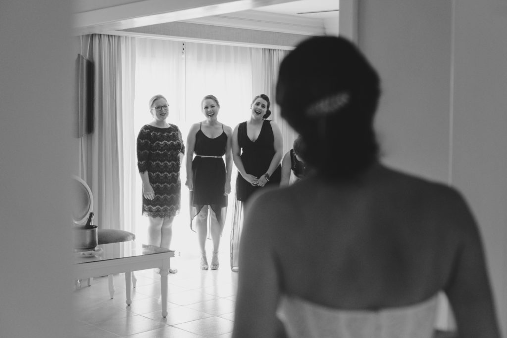 bridesmaids seeing the bride in her dress for the first time