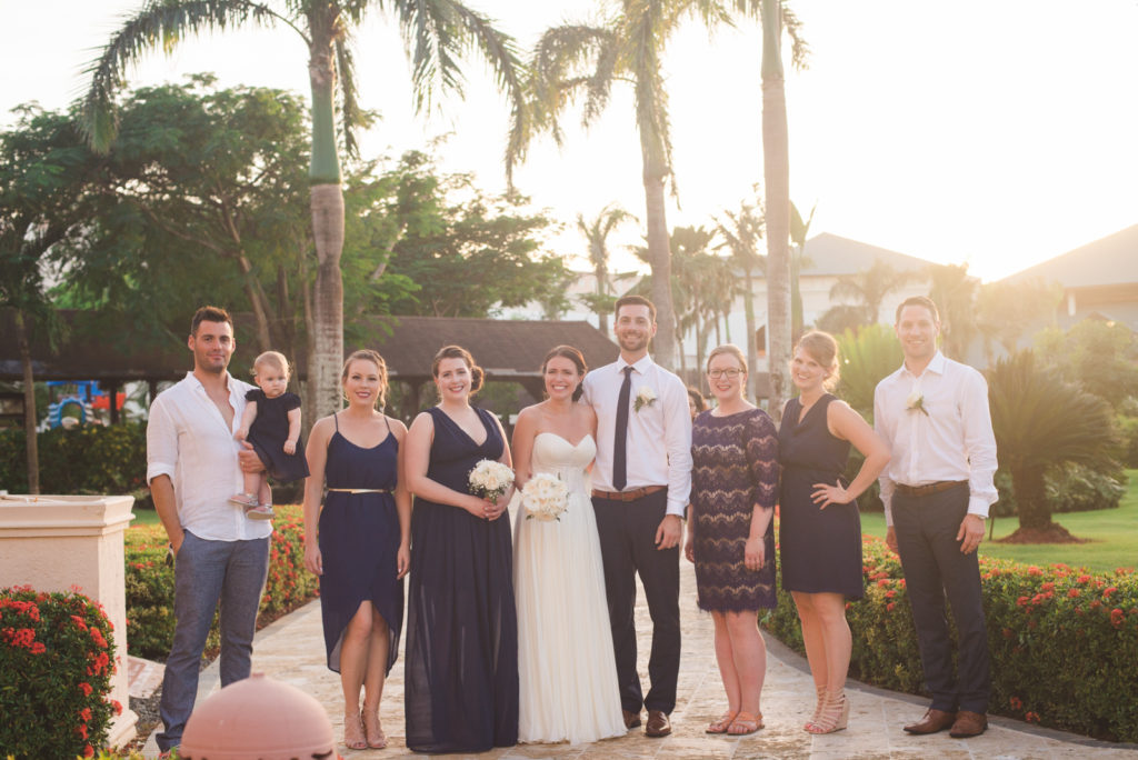 wedding party at sunset with palm trees