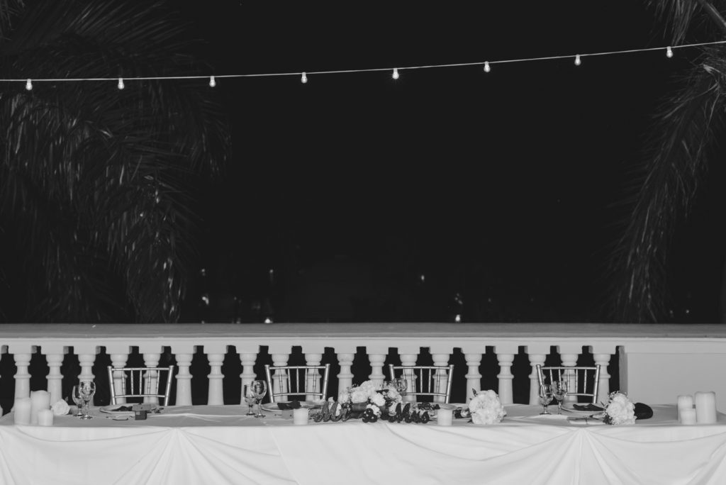 head table with twinkly edison lights