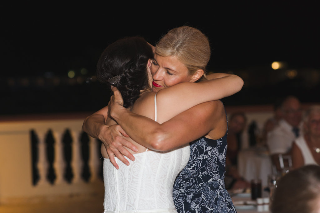 mother of the bride hugging the daughter