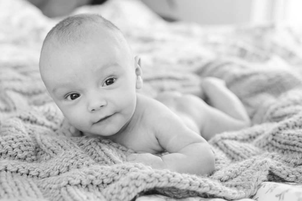 naked baby boy on a wool blanket in black and white