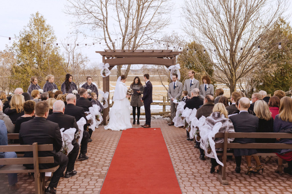 outdoor winter wedding ceremony at Strathmere Lodge