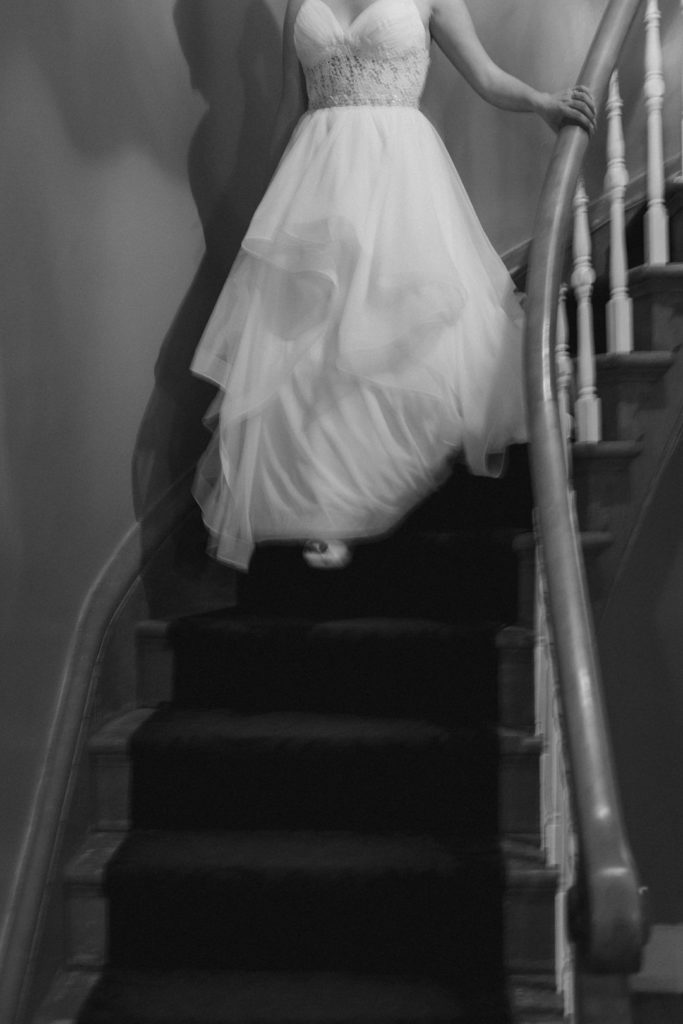 bride walking down a spiral staircase