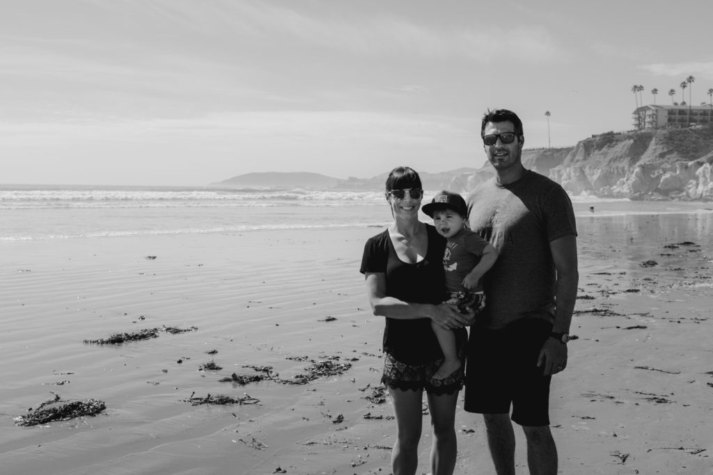 parents with their son on pismo beach