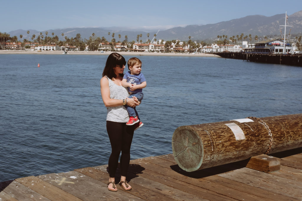 mom and son standing on the pier of Santa Barbara