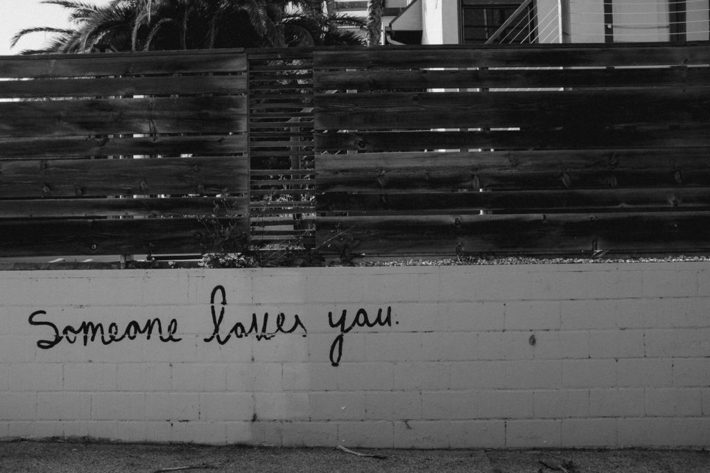 los angeles graffiti that says "someone loves you"