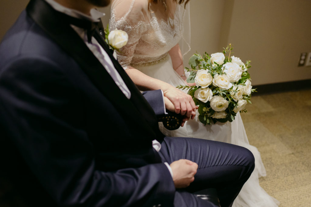 bride and groom holding hands before the wedding ceremony