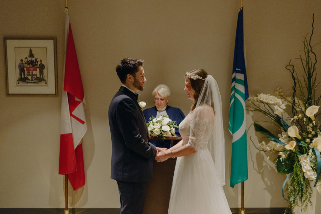 Bride and groom standing together at the alter of their civil ceremony