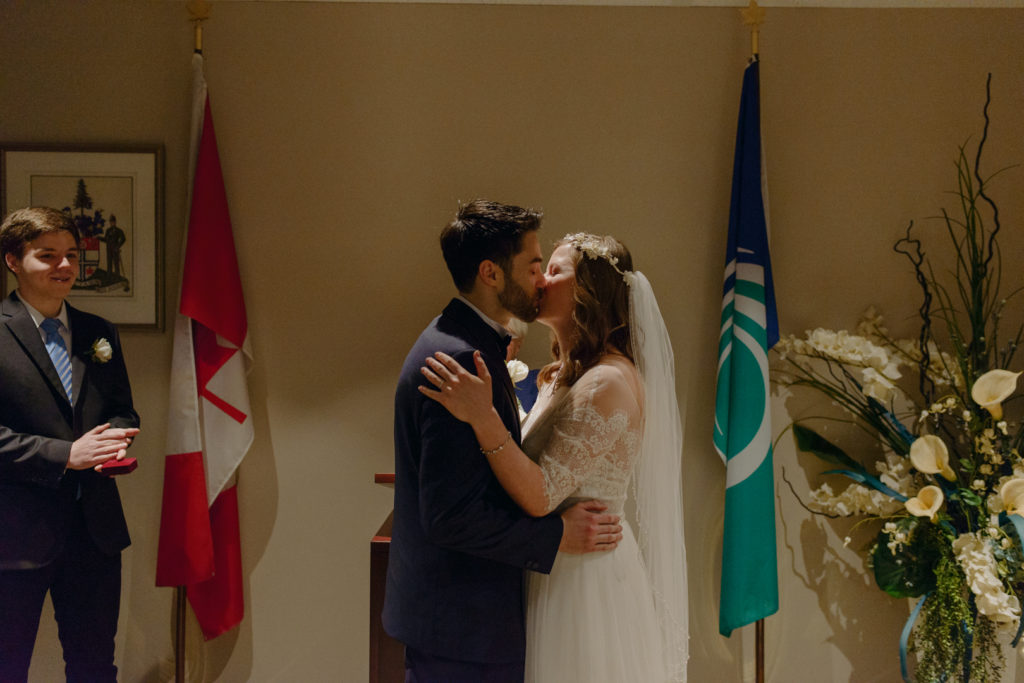 bride and groom first kiss