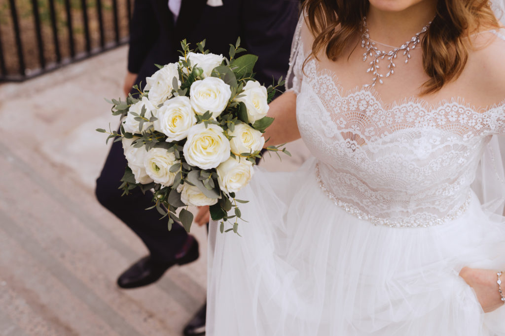 bride and groom walking up a staircase