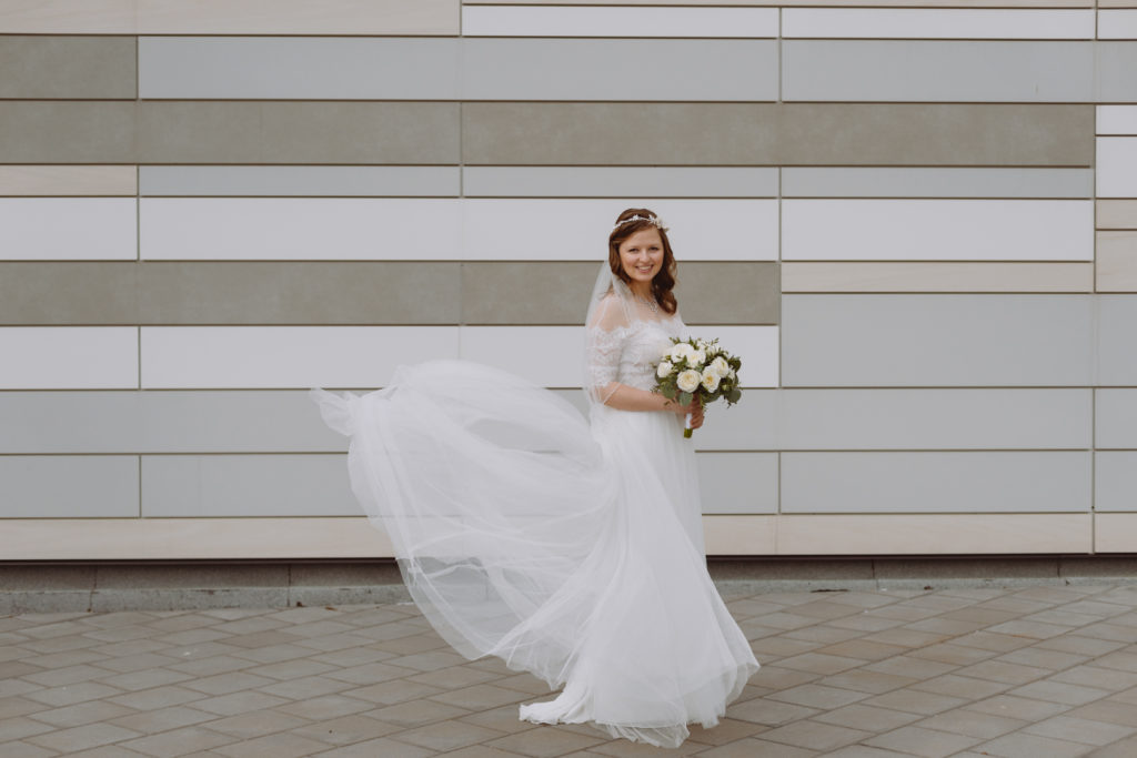 bride's train blowing in the wind