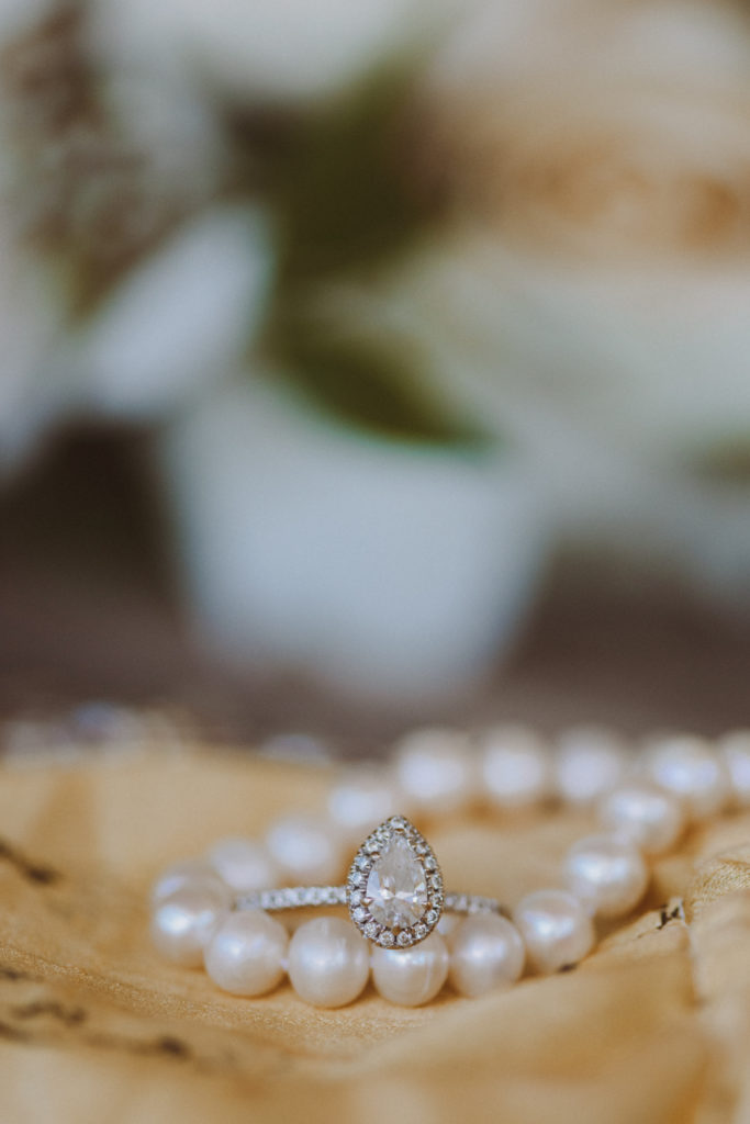 pear shaped wedding ring with pearl necklace