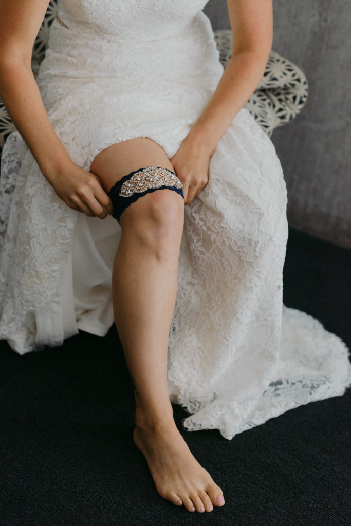 bride putting on her garter